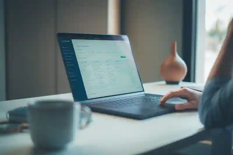 Person reviewing activity on a laptop