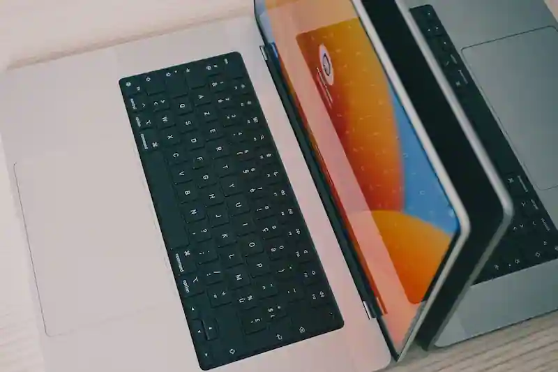 Two laptops side by side for comparing ecommerce software