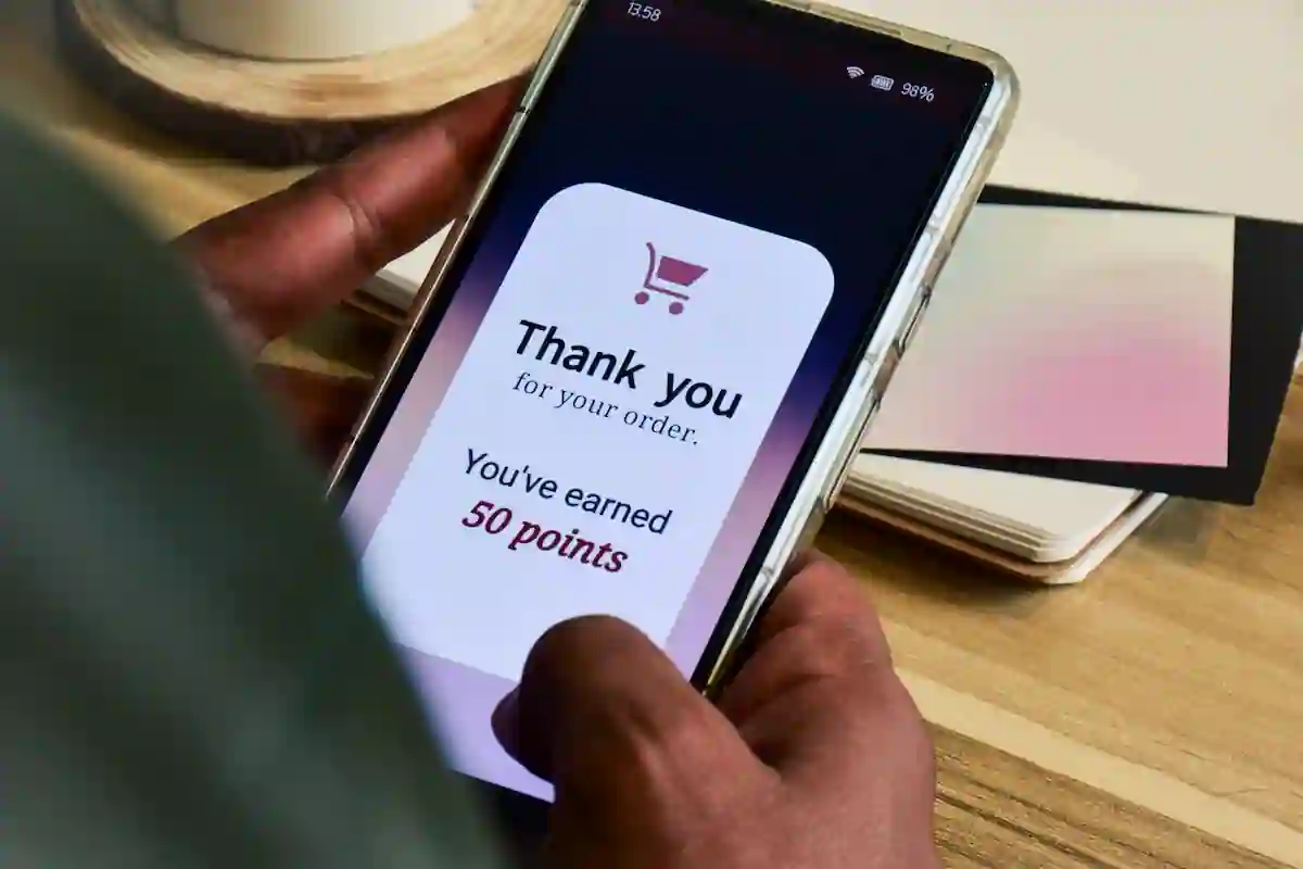 A person gaining loyalty points from a purchase