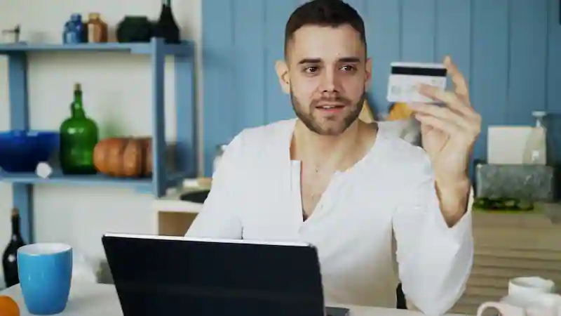 Customer shopping online with a laptop
