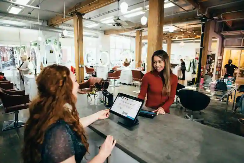 Customer completing a purchase at a small business